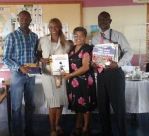 Representatives from the school accepting their donation of books 